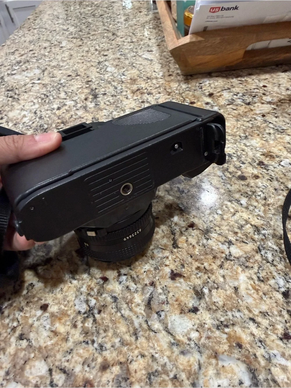 Canon T50 Black 35mm SLR Camera with Attached Lens